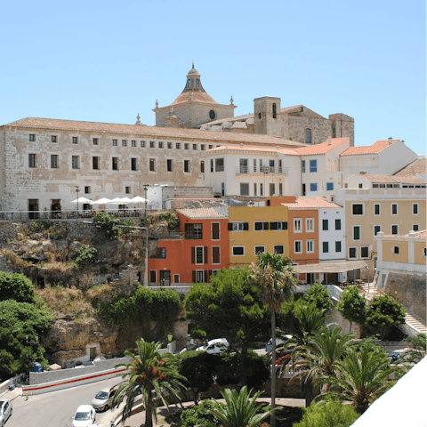 Stroll the colourful streets of Mahón, only a short drive away