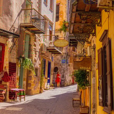 Explore the narrow lanes and alleyways of Chania's atmospheric old town, a short drive away