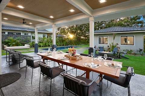 Dine alfresco as the sun sets over the tropical garden