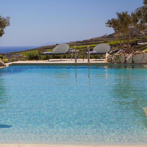 Admire the Aegan Sea and surrounding scenery from the infinity pool