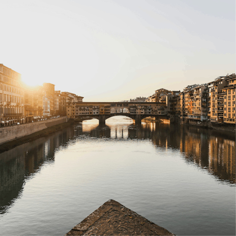 Take an evening stroll towards Ponte Vecchio