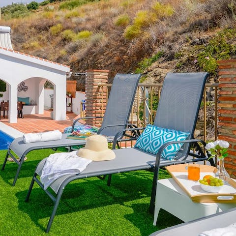 Flop down on a sun lounger with a good book and a cool drink