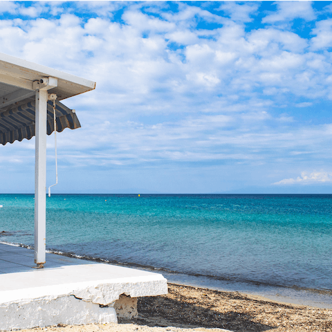 Spend a day at the nearby Fourka beach, just a seven-minute walk away