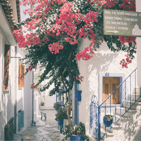 Get lost roaming the charming streets of Skiathos Town – it's ten minutes away by car
