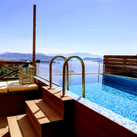 Enjoy an afternoon dip in the private pool, admiring the sea in the distance