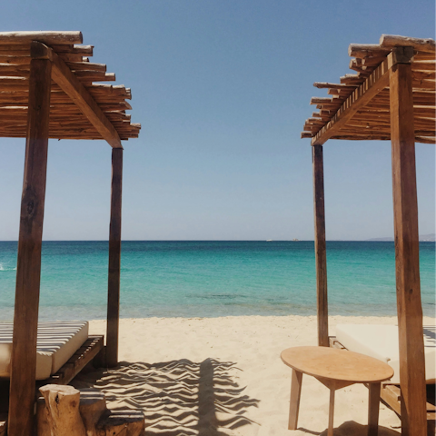 Sprawl out on Plaka Beach, a four-minute walk away