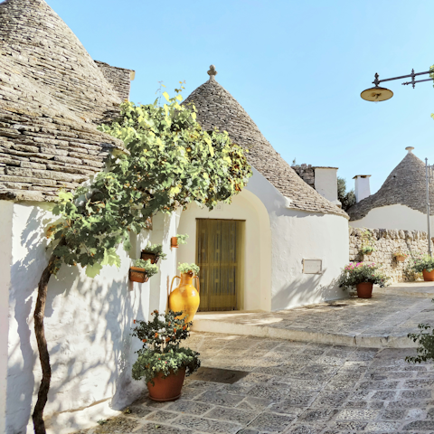 Visit the historic trulli-filled town of Alberobello