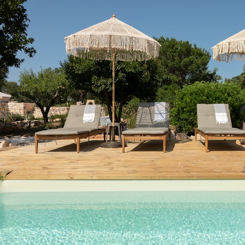 Spend your days poolside with a drink in hand