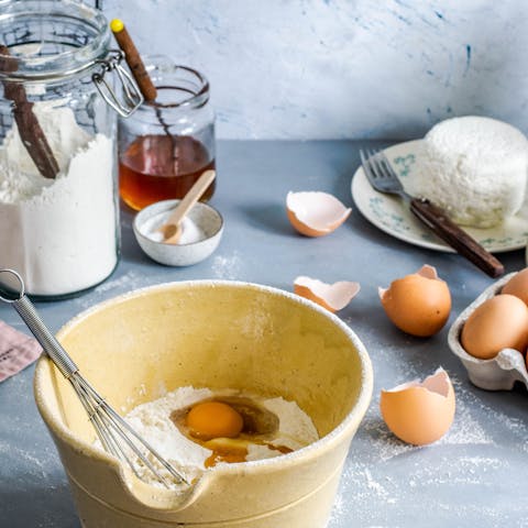 Make some bigoli in salsa (pasta in an anchovy sauce) in a cookery class arranged by your host