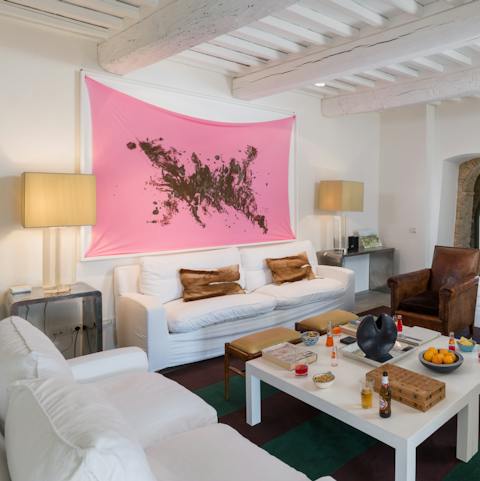 Appreciate the modern interiors with daring artworks on show