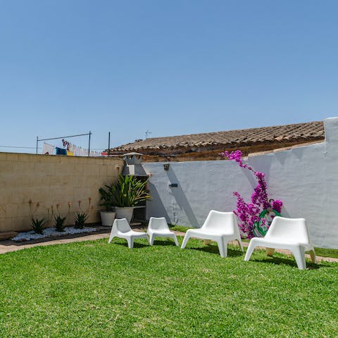 Pour yourself a glass of wine and relax in the garden