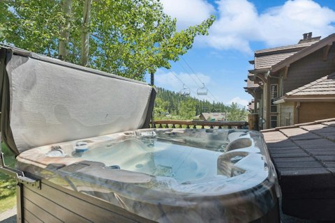 Soak in the hot tub while admiring your scenic surroundings