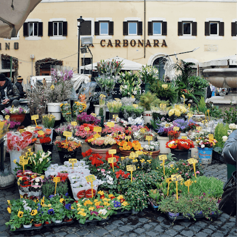 Pick up fresh fruit and flowers at Campo de' Fiori Market
