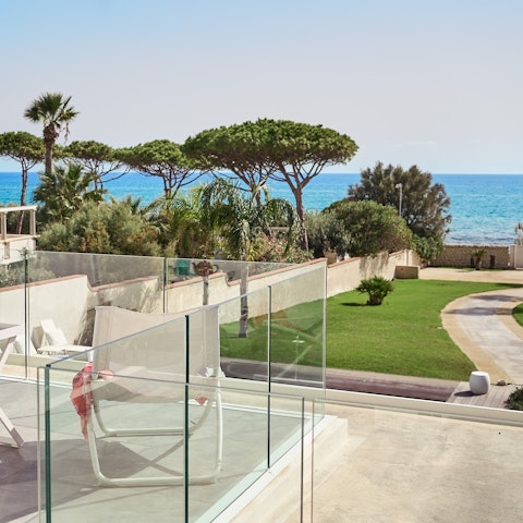 Watch the sunset from the upstairs terrace with uninterrupted sea views