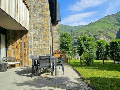 Dine alfresco with lush green slopes stretching into the distance