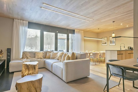 Spend evenings together in this warm, light-filled room