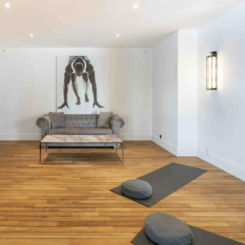 Do the downward dog in the private yoga studio