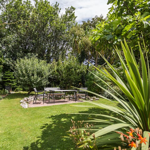 Step outside into the garden oasis and embrace the rejuvenating spirit of the sea