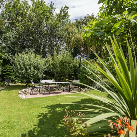 Step outside into the garden oasis and embrace the rejuvenating spirit of the sea