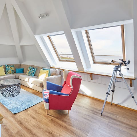 Jump on the telescope and look out for wild birds flying over Budle Bay