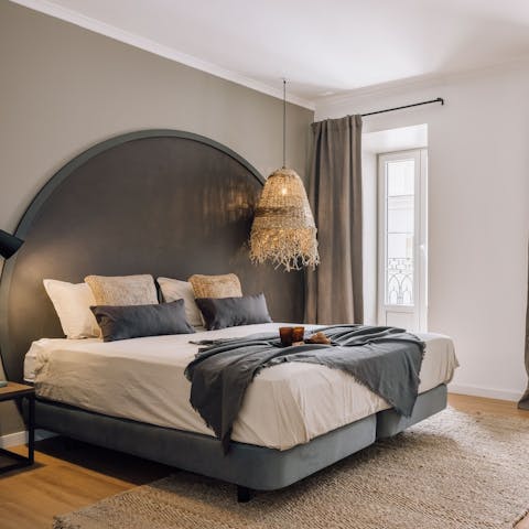 Fall blissfully asleep in your sanctuary-like bedroom, the soft glow of the city outside your window