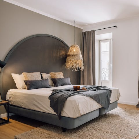 Fall blissfully asleep in your sanctuary-like bedroom, the soft glow of the city outside your window