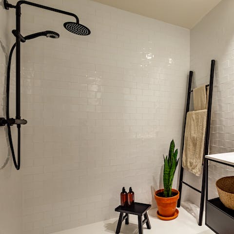 Start mornings with a relaxing soak under the bathroom's rainfall shower
