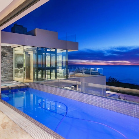 Dive into your private swimming pool just in time to watch the sunset