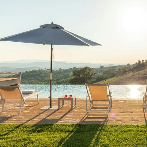 Admire the Tuscan countryside views from the private pool