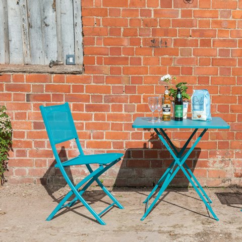 Enjoy a local cider in the sunshine on the private patio
