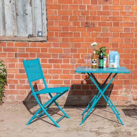 Enjoy a local cider in the sunshine on the private patio