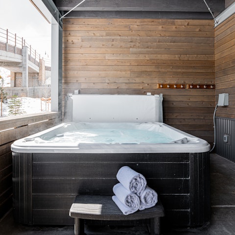 Relax in the private hot tub after a hike in the mountains