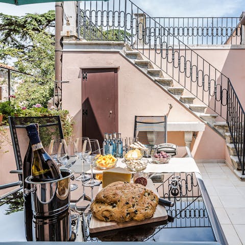 Enjoy a glass of Prosecco on the shared terrace