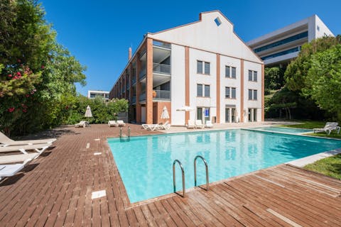 Swim in the communal pool to beat the Algarve heat