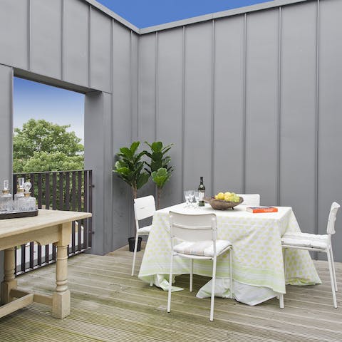 Enjoy alfresco fry-ups on sunny days with framed views of the cityscape