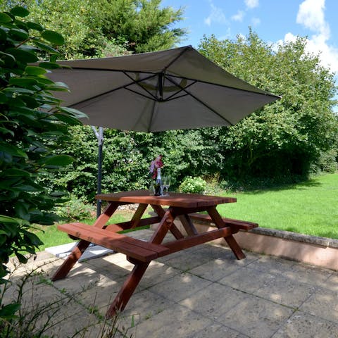 Bring a glass out of wine out to the patio table