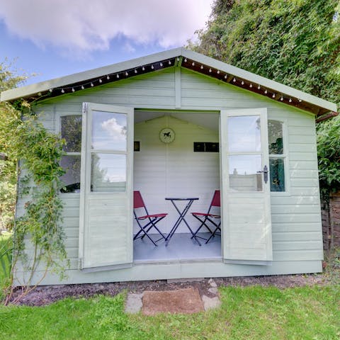 Spend some quiet time reading or working in the summer house