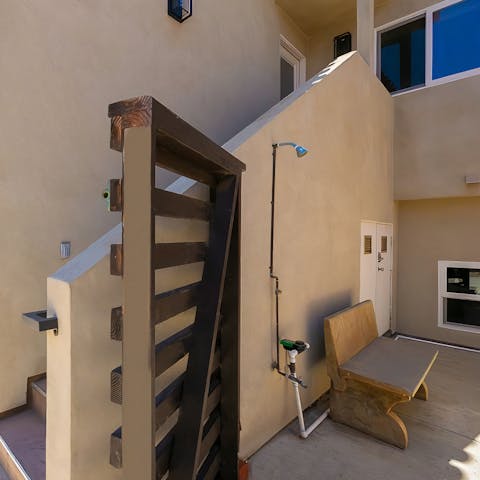 Walk back home in less than fifteen minutes from the beach and rinse off the sand