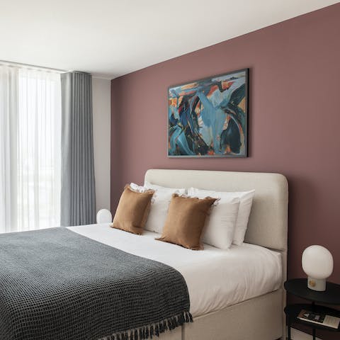 Kick back in the comfortable bed after racking up some steps in the city