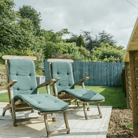 Relax on the sun loungers with a drink while the kids play in the garden