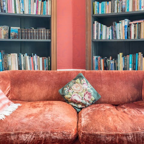 Select something to read from the towering bookshelves