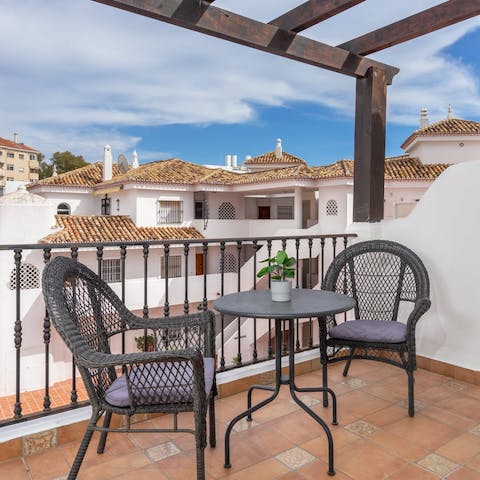 Sip a glass of sangria on the balcony terrace