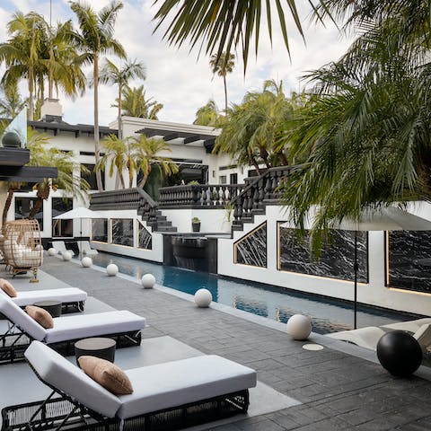 Slip into the infinity pool and listen to the trickle of the waterfall