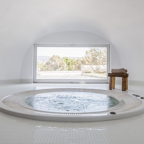 Luxuriate in the hot tub complete with a view of the local countryside