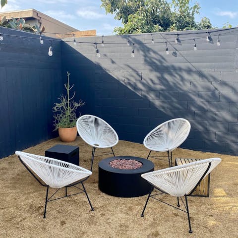 Sit out under the string lights and share drinks around the fire pit
