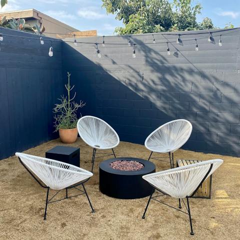 Sit out under the string lights and share drinks around the fire pit