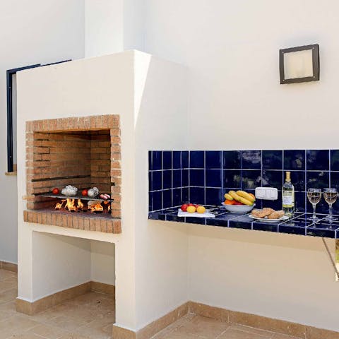 Grill a Mediterranean barbecue feast at the outdoor kitchen