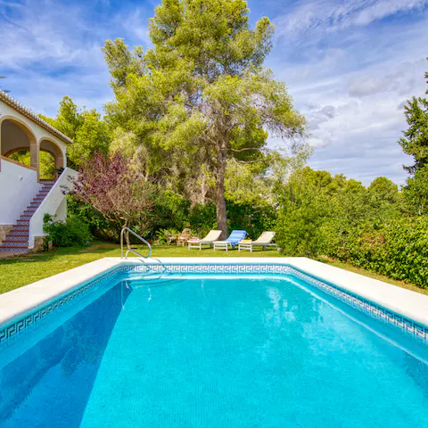 Dip in and out of the pool and lounge on the lawns