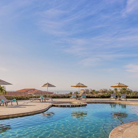 Go for a dip under the sun in the large communal pool