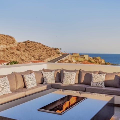 Gather around the fire pit and share evening drinks with gorgeous sea views